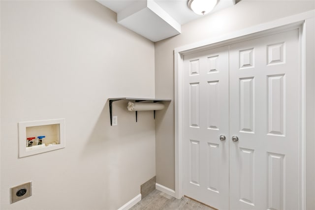 washroom featuring light hardwood / wood-style flooring, washer hookup, and hookup for an electric dryer