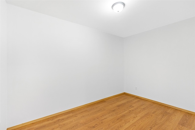 spare room featuring hardwood / wood-style floors