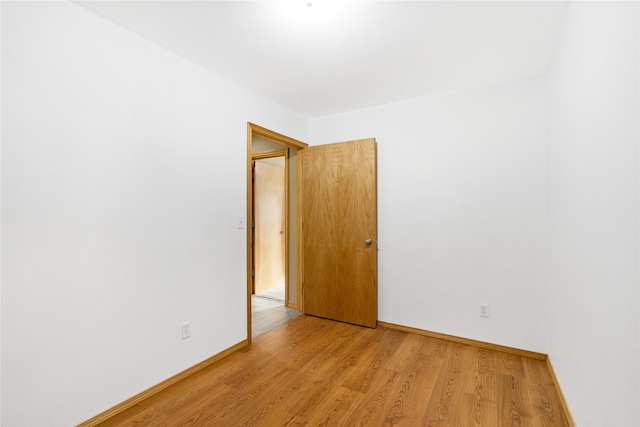 spare room with light wood-type flooring