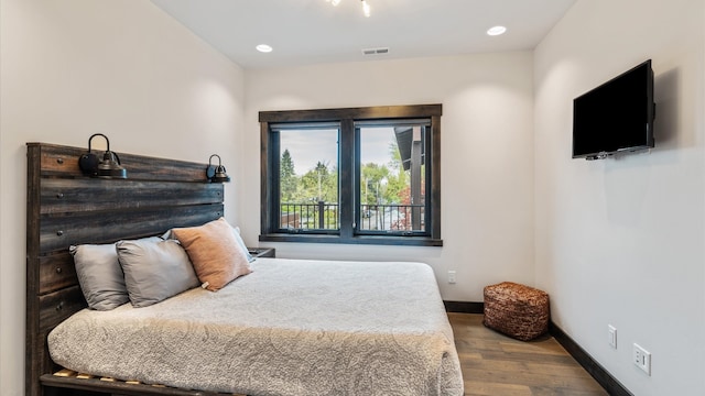 bedroom featuring wood-type flooring