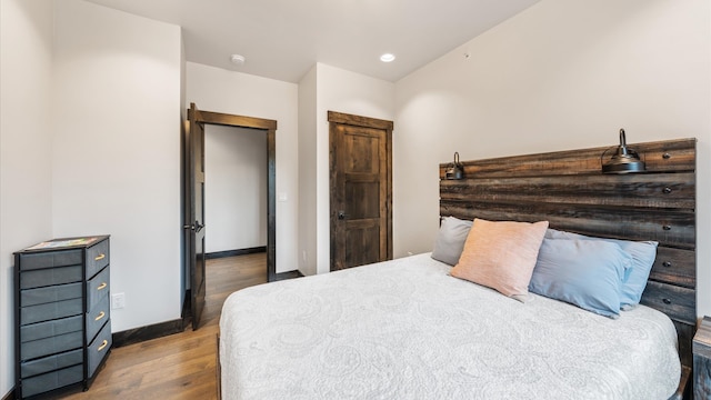 bedroom featuring wood-type flooring