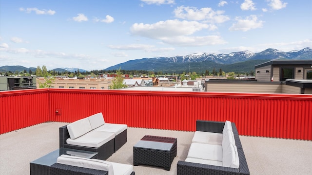 view of patio / terrace with a mountain view and a balcony