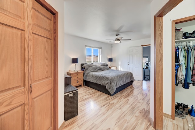 bedroom featuring ceiling fan, a closet, and light hardwood / wood-style floors