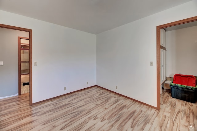 spare room featuring light wood-type flooring