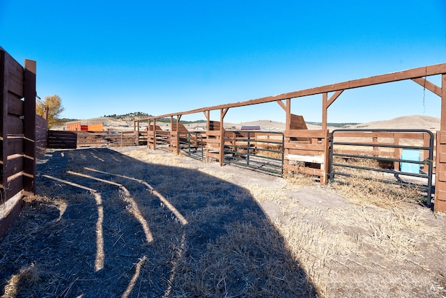 view of yard with an outbuilding and a rural view