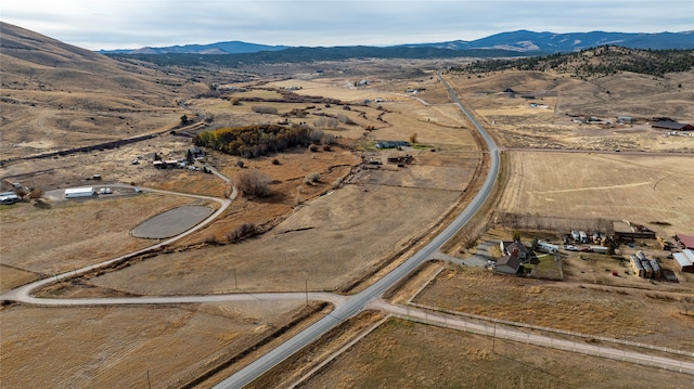 birds eye view of property featuring a mountain view and a rural view