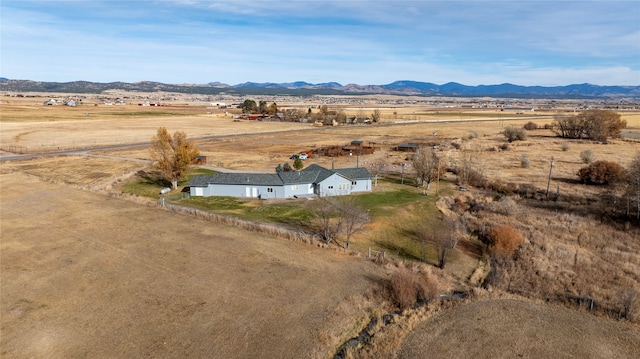 drone / aerial view featuring a mountain view and a rural view