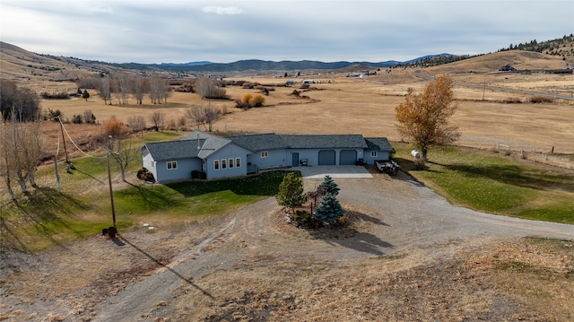 drone / aerial view with a mountain view and a rural view