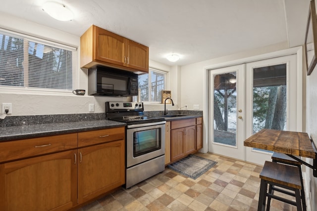 kitchen with french doors, sink, and stainless steel electric range