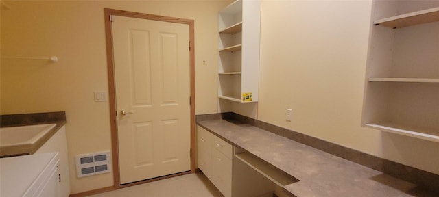 interior space with a sink and visible vents