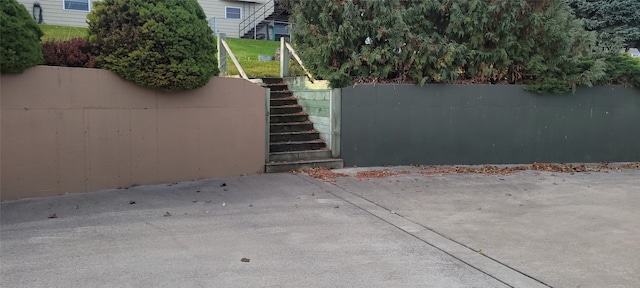 exterior space featuring stairs and fence