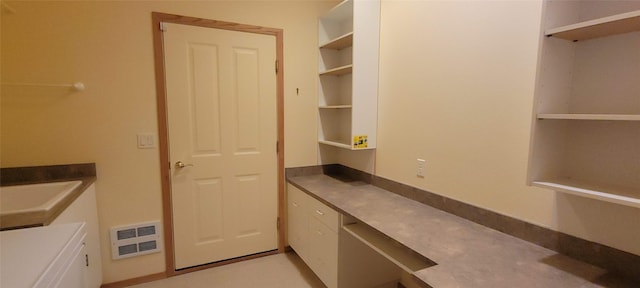 interior space featuring white cabinetry