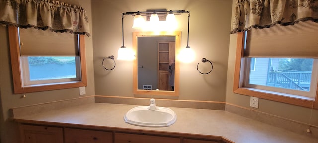 bathroom featuring vanity and plenty of natural light