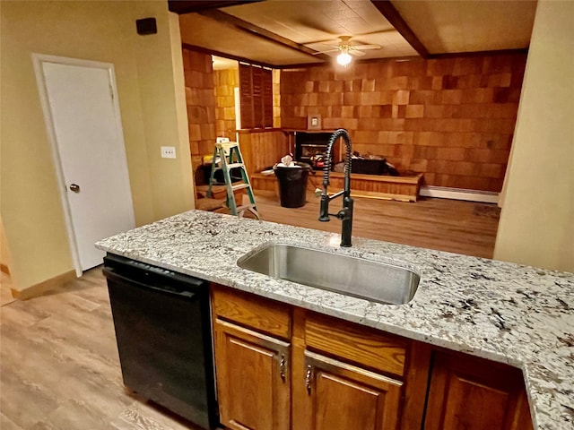 kitchen with dishwasher, light hardwood / wood-style flooring, ceiling fan, and sink