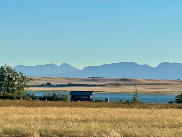 view of mountain feature with a water view