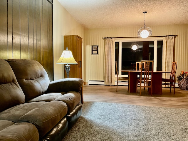 sitting room featuring hardwood / wood-style floors and a textured ceiling