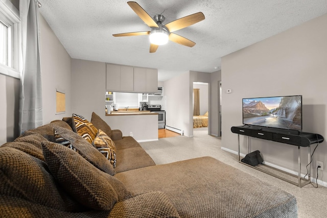 121 Mill Ave, Whitefish, MT 59937 - living room with light colored carpet, a ceiling fan, baseboard heating, and a textured ceiling