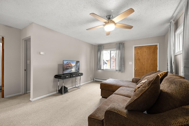 121 Mill Ave, Whitefish, MT 59937 - carpeted living area with ceiling fan, a textured ceiling, and a baseboard radiator
