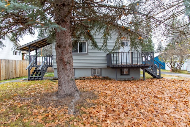 121 Mill Ave, Whitefish, MT 59937 - rear view of house with stairs and a wooden deck