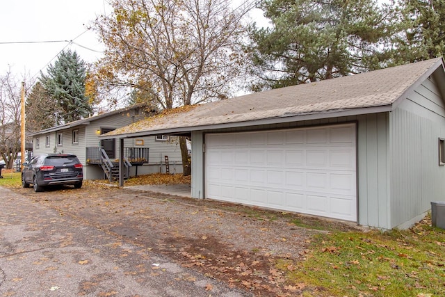 121 Mill Ave, Whitefish, MT 59937 - view of front of home with a detached garage, an outbuilding, and a shingled roof