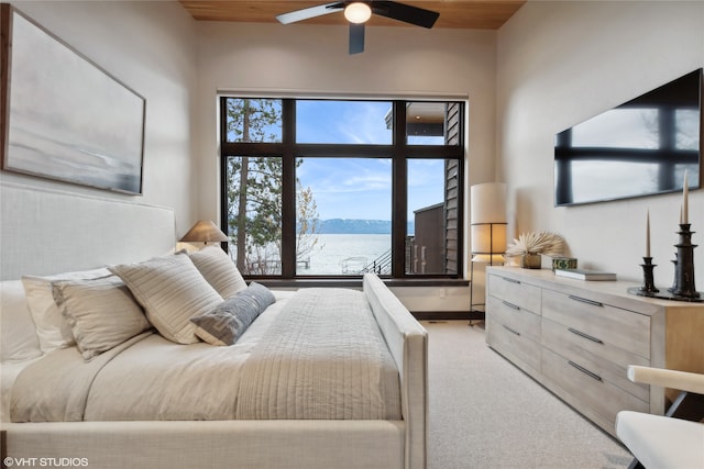 carpeted bedroom with ceiling fan and wood ceiling