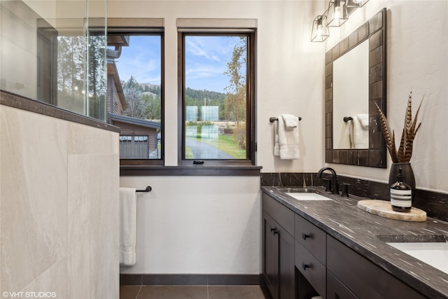 bathroom with tile patterned flooring and vanity