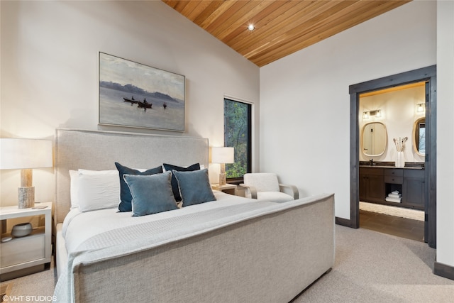 bedroom with connected bathroom, sink, lofted ceiling, light carpet, and wood ceiling