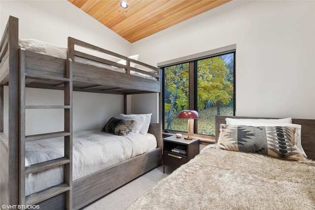 bedroom with wood ceiling and vaulted ceiling