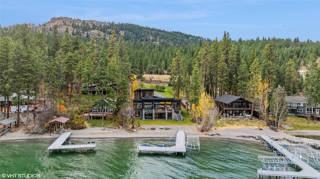 drone / aerial view featuring a water and mountain view