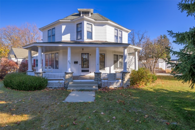 view of front of house with a front lawn and covered porch