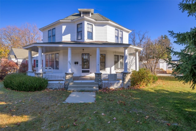 200 N 5th St, Hamilton, MT 59840 - view of front facade with covered porch, a front lawn, and a shingled roof