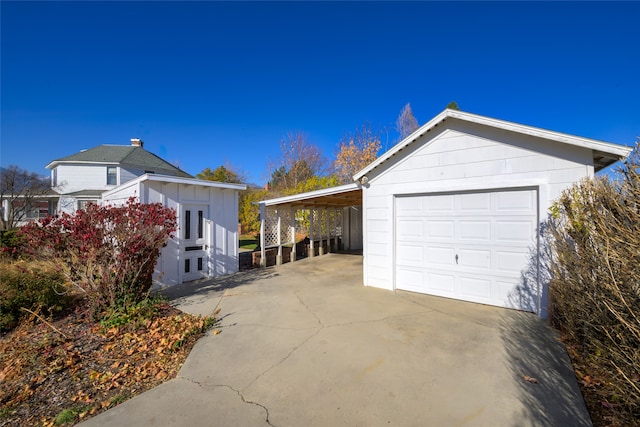 view of side of home with an outdoor structure and a carport