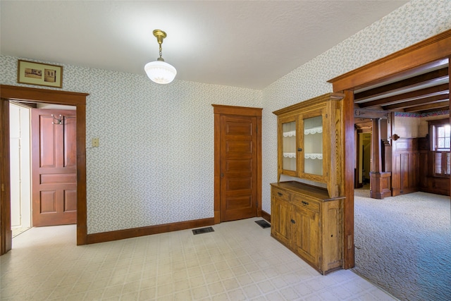 empty room with light colored carpet