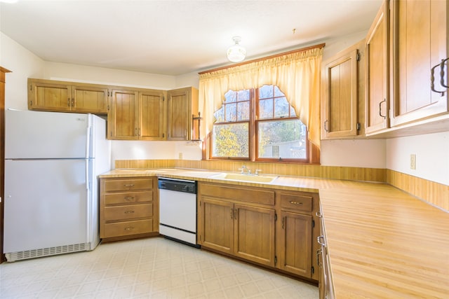 kitchen with sink and white appliances