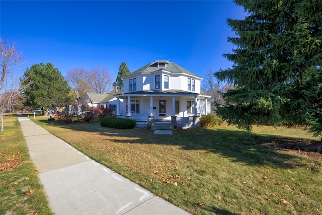 view of front of home featuring a front yard and a porch