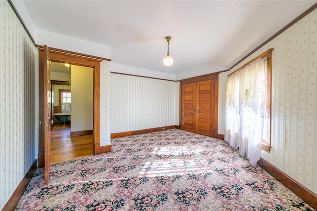 bedroom with hardwood / wood-style floors and multiple windows