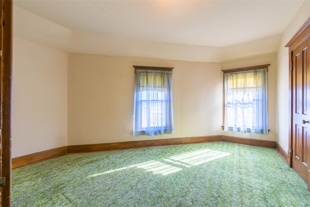 spare room featuring carpet floors