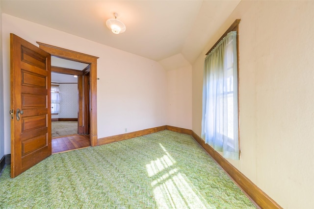 200 N 5th St, Hamilton, MT 59840 - spare room featuring carpet flooring, baseboards, and vaulted ceiling
