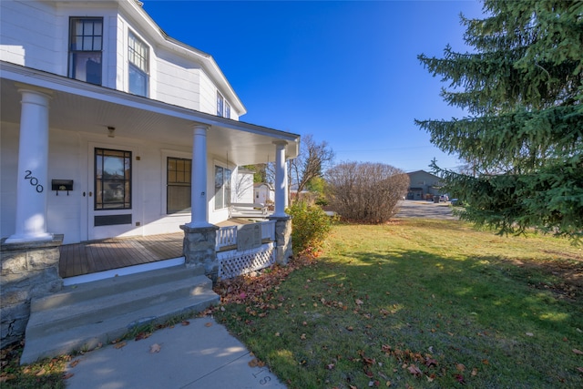 exterior space with a porch and a yard