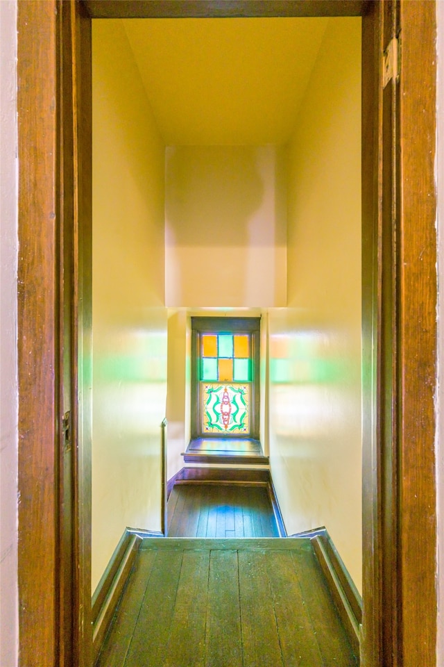 hall with wood-type flooring