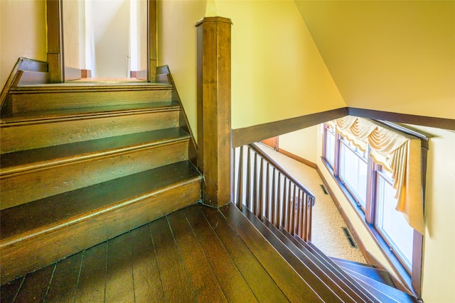 stairs with wood-type flooring