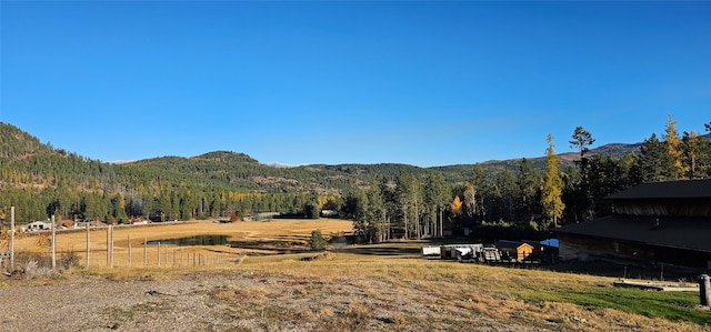 mountain view featuring a rural view