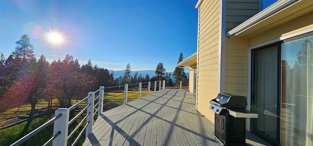 exterior space featuring a grill and a mountain view