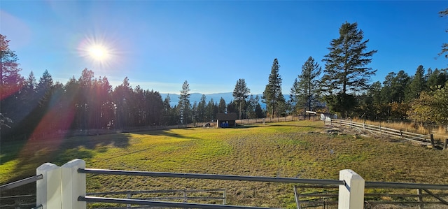 view of yard with a rural view