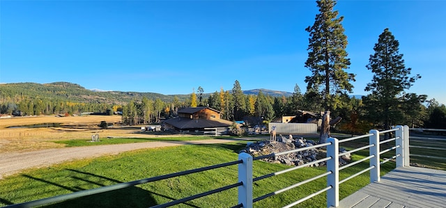 view of yard featuring a mountain view and a rural view