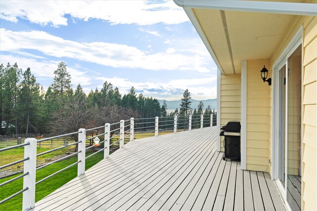 wooden deck featuring area for grilling