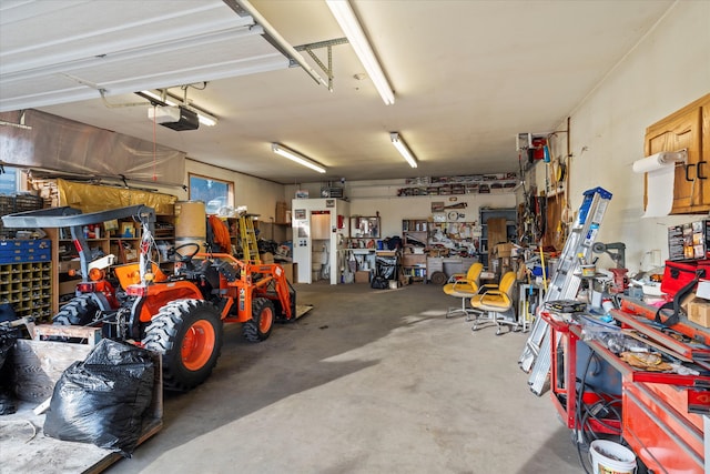 garage featuring a workshop area and a garage door opener