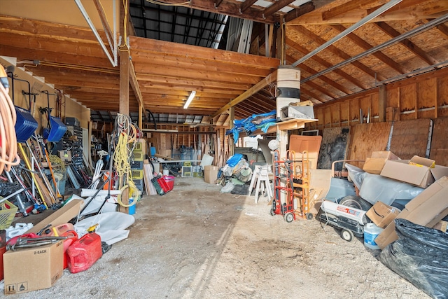 misc room featuring concrete flooring and lofted ceiling