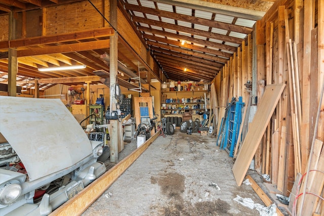 misc room with a workshop area and lofted ceiling