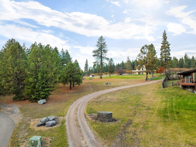 view of home's community with a lawn